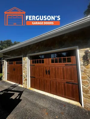 Warm wood carriage-style garage doors on stone ranch home